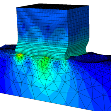 The figure shows a cube meshed with finite elements with curved sides which show large plastic shearing. The body is in contact with a lengthy baseplate which has a honey-comb-like surface structuring on the top contact surface. The cube-metal seems to flow around the honeycomb surface structures and a rainbow-colorplot shows the resulting contact stress distribution.